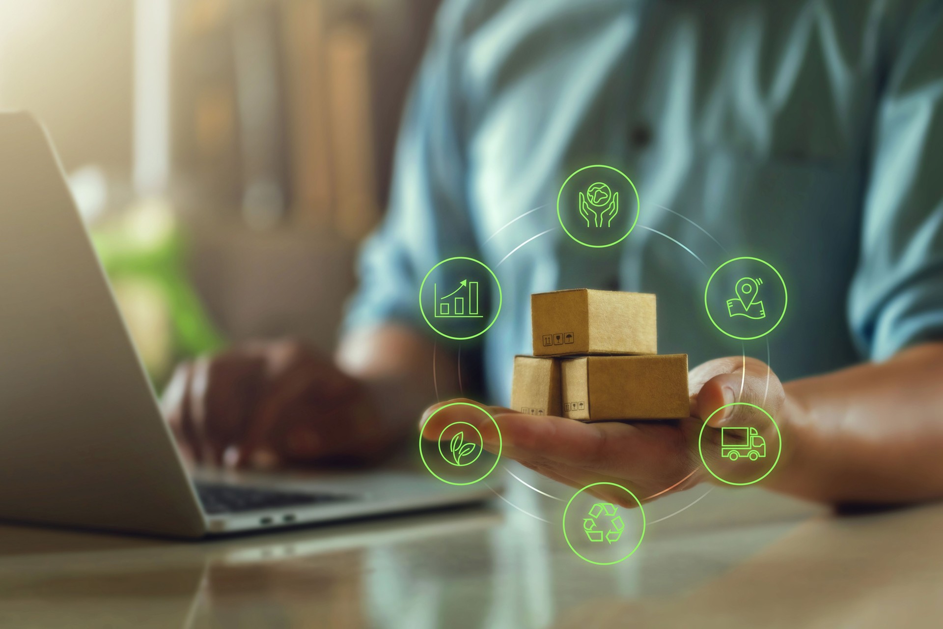 Green logistics or Sustainable global transport. Sustainable logistics businessman holding a parcel and eco packaging with logistics icons.Transport Management System technology for clean energy.